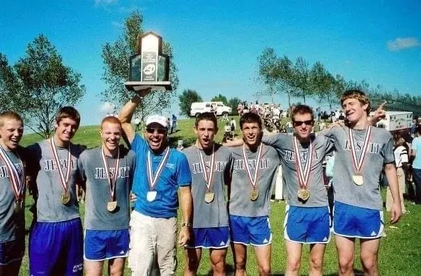 Coach Boza and his state champion cross country team